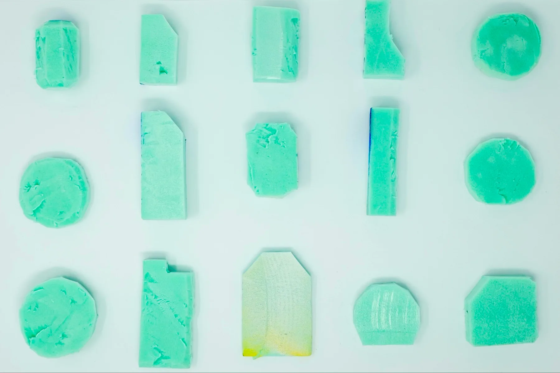 Fifteen green 3D-printed form studies