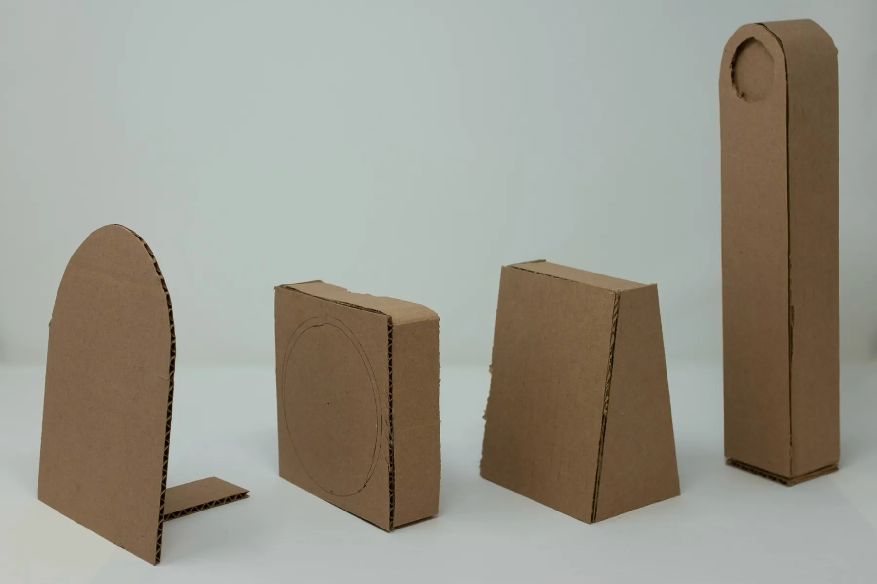 Cardboard models of the stand at different heights