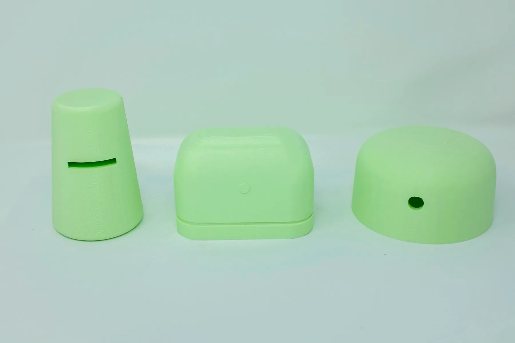 Three green 3D-printed enclosure studies