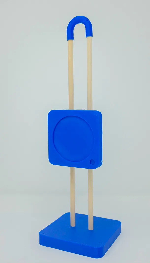 Blue 3D-printed prototype of the stand on wooden rods