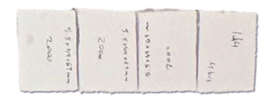 Four foam battery blocks labelled with their capacities