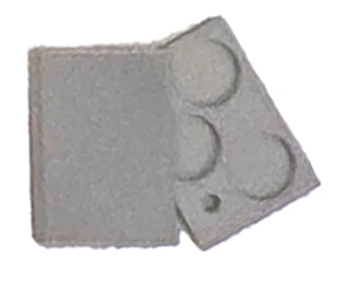 A grey battery housing and coin-cell tray