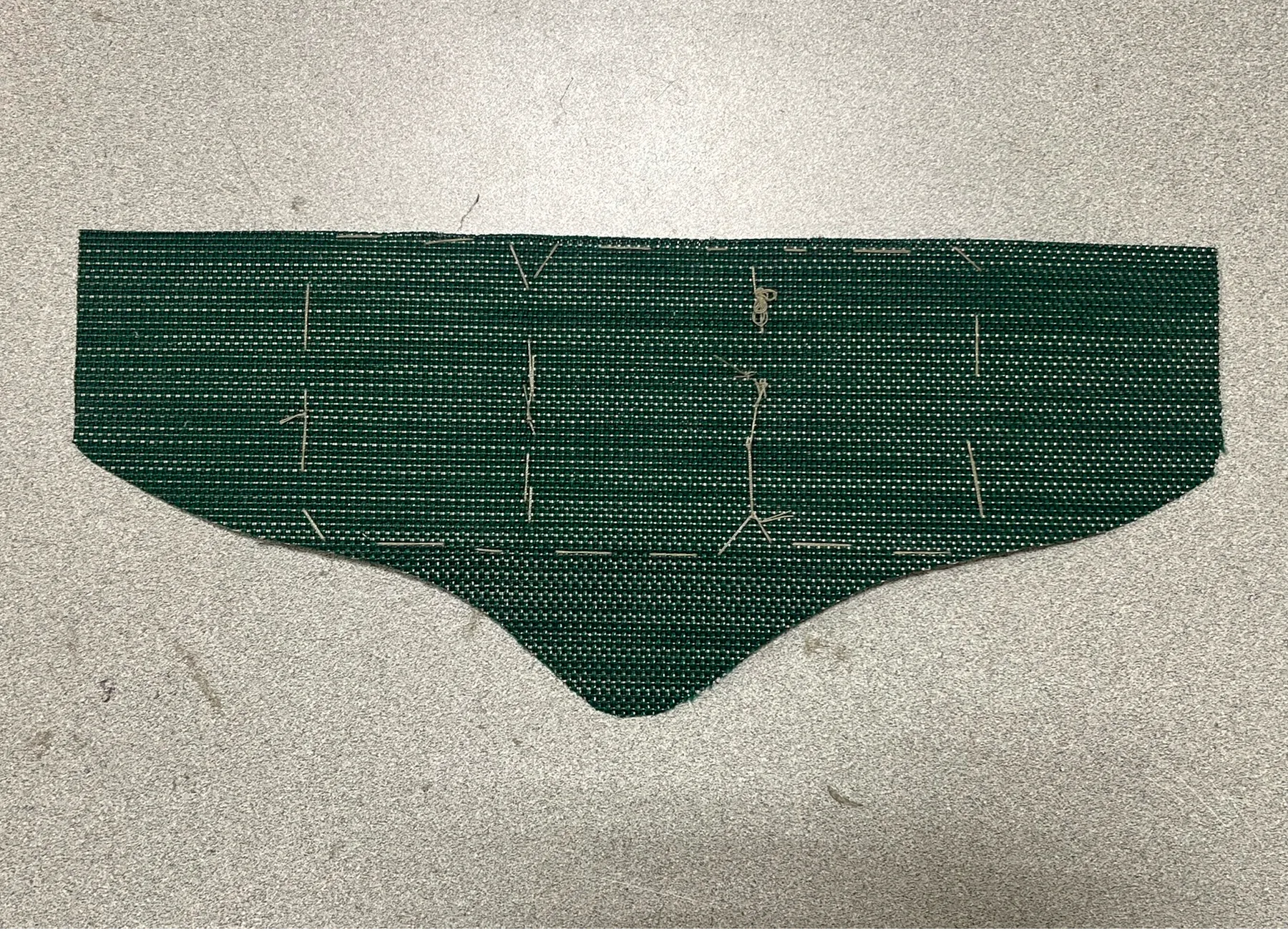 Green knit belt panel with stitching guides
