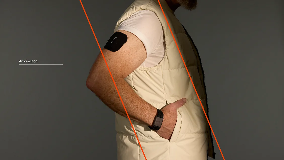 Art direction: a man wearing the Limbo sensor and band, with an orange diagonal line cutting across the photo