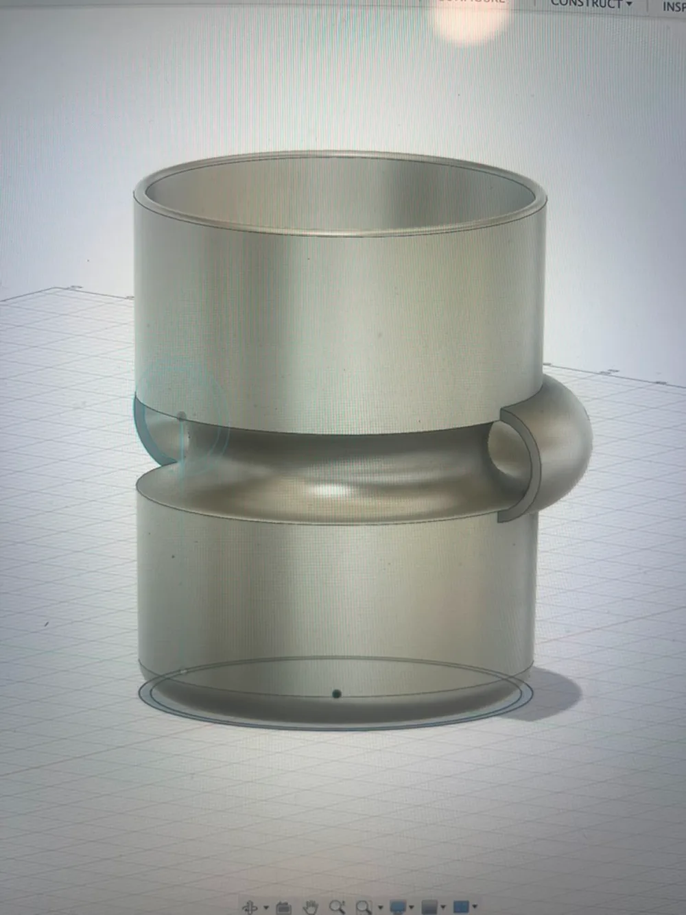 CAD model of a mug with its handle wrapped around the body