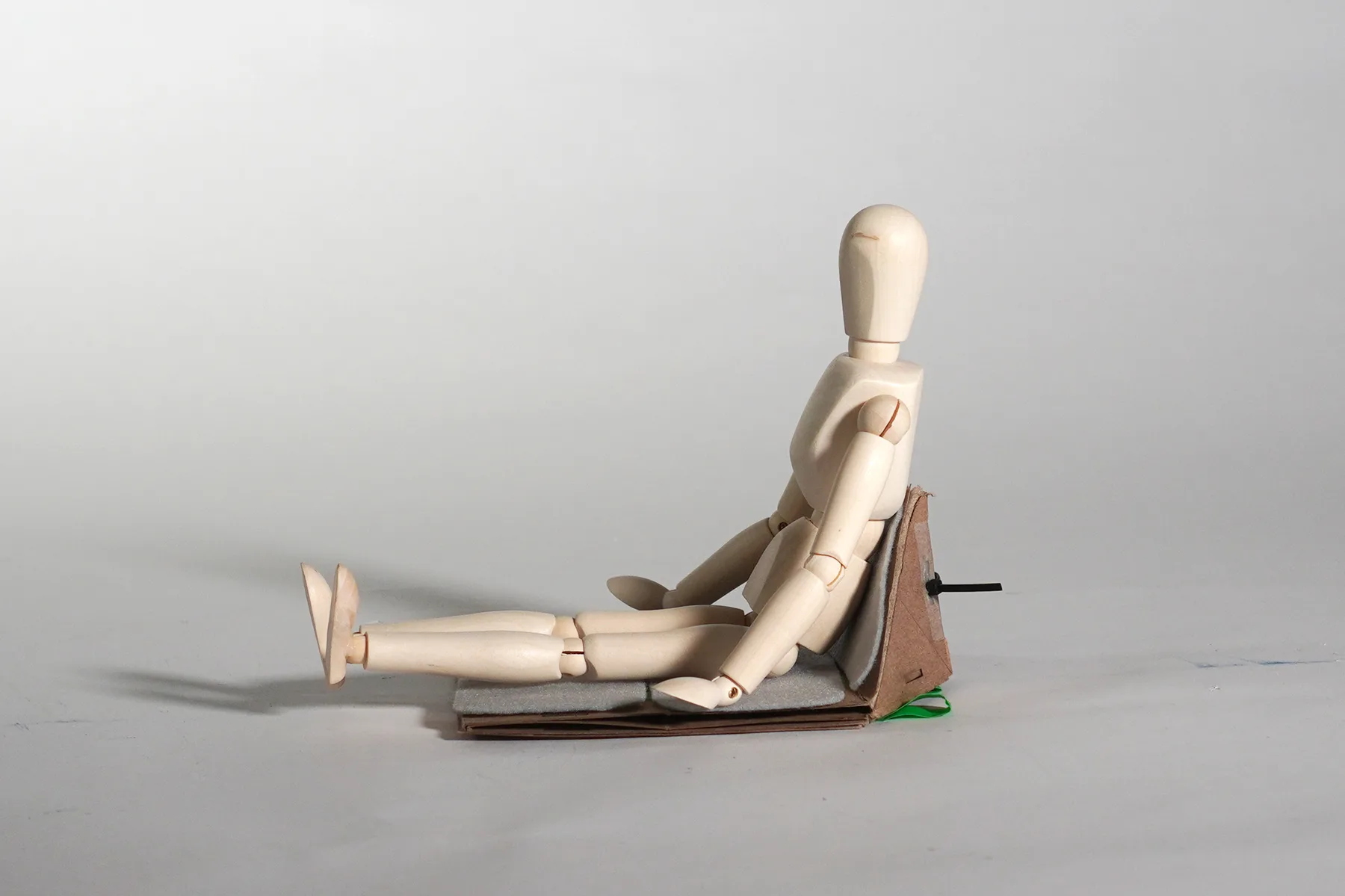 Scale figure sitting on the shelter unfolded as a seat